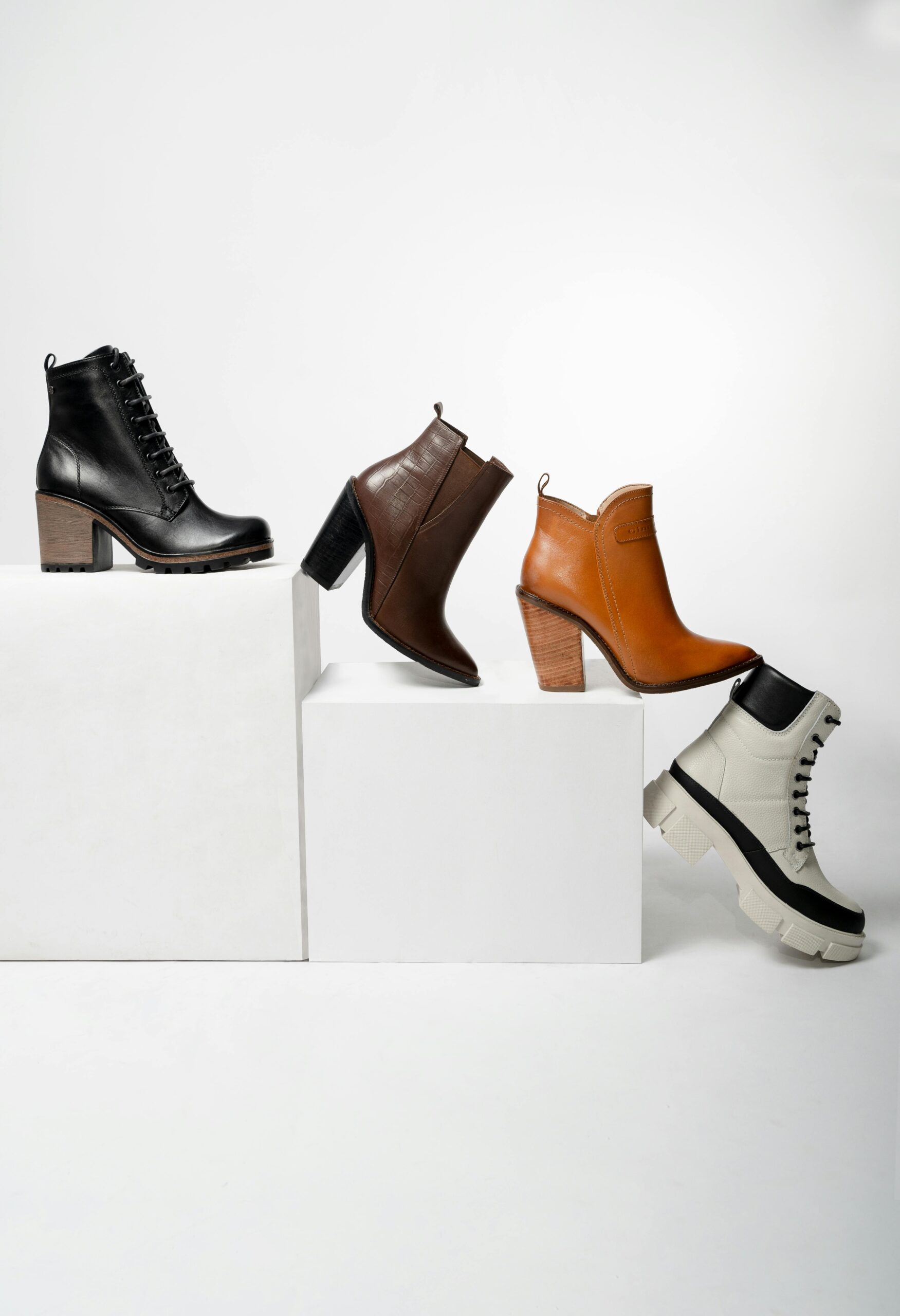 Elegant collection of women's leather boots showcasing variety in style and color.